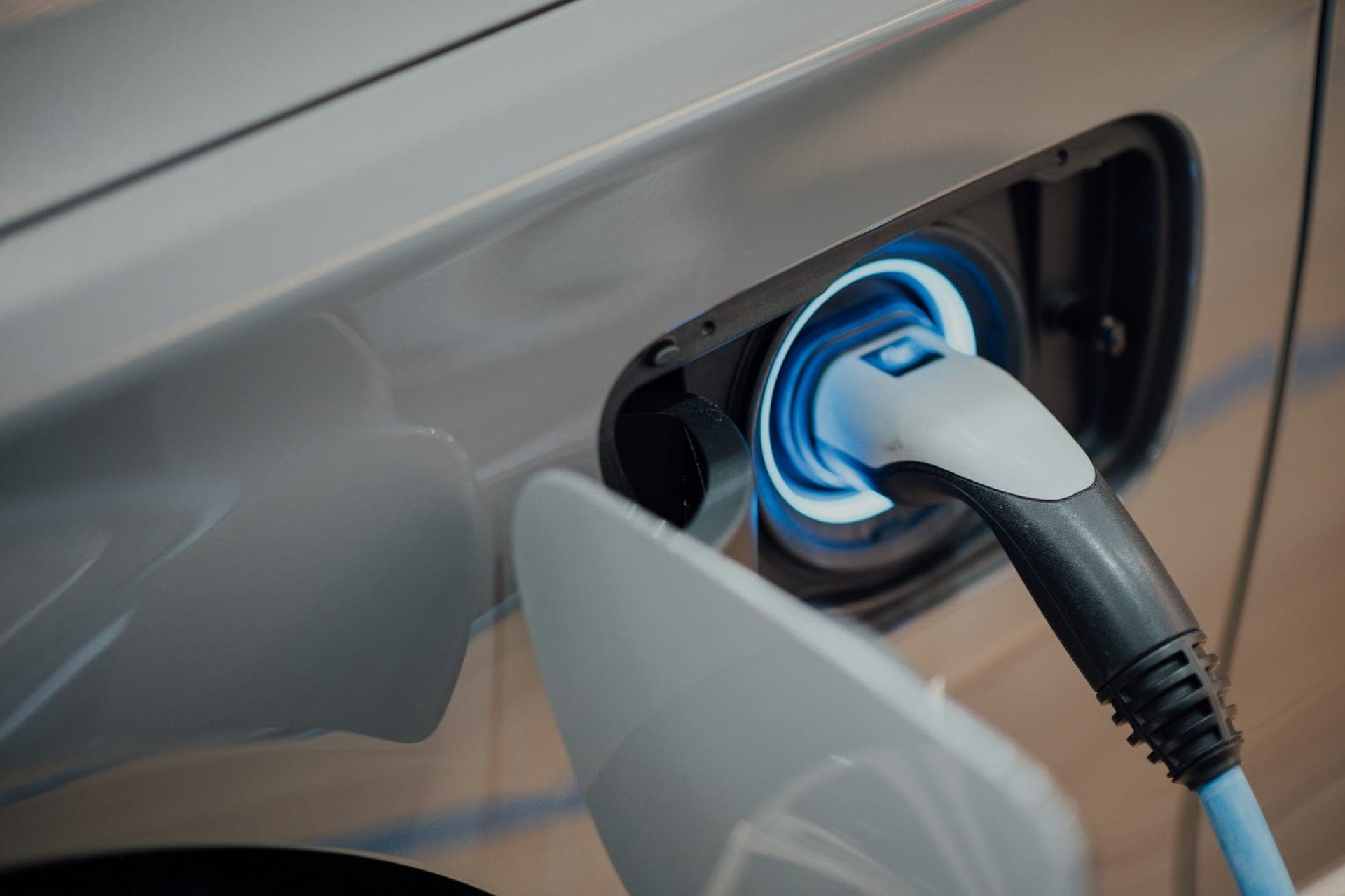 Electric vehicle connected to a charging plug